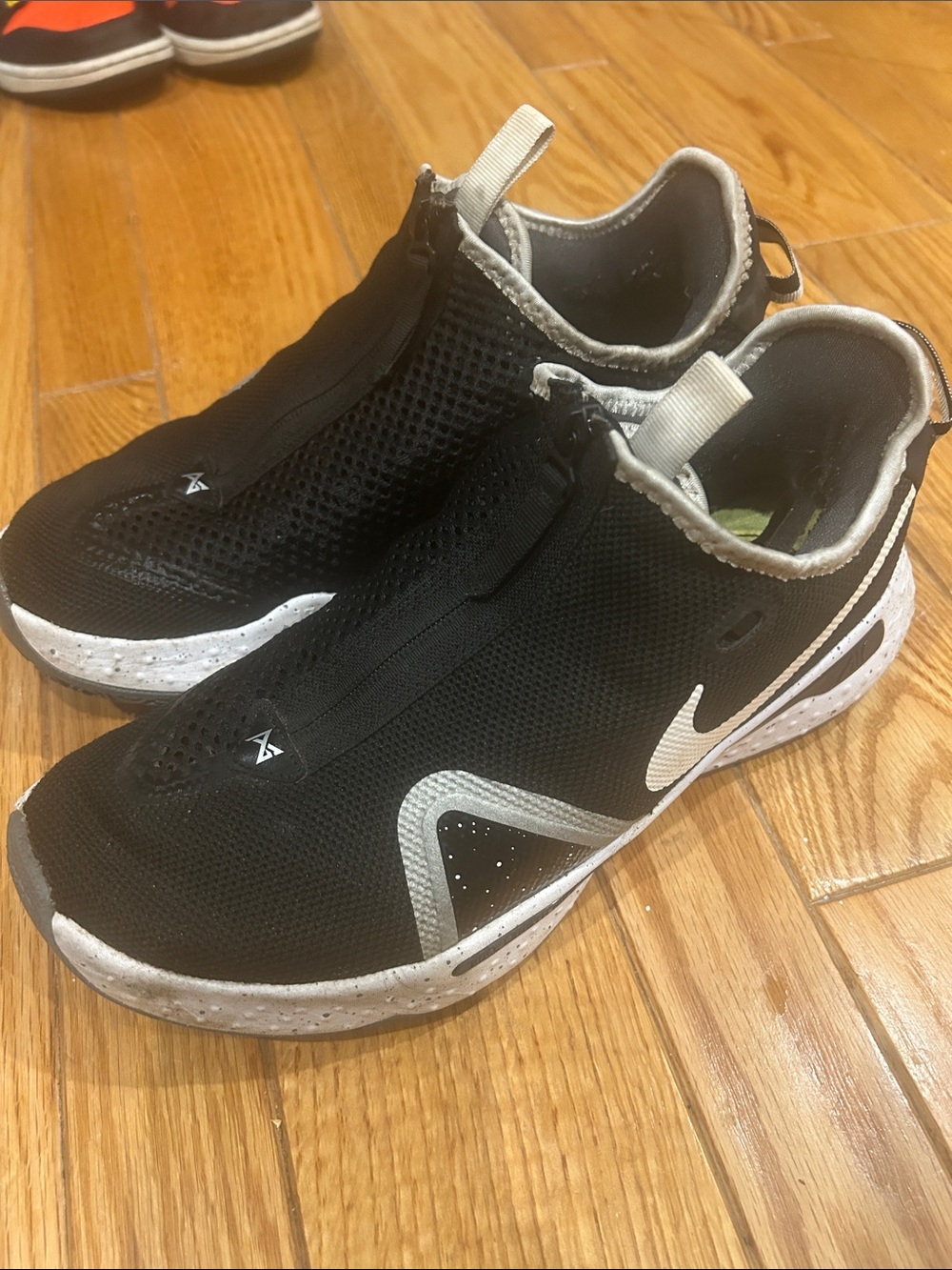 Nike Men’s Black and White Slip-On Athletic Sneakers